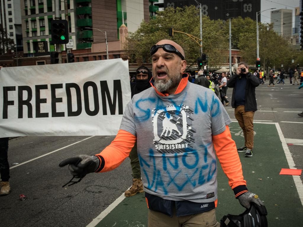 A man yells at police on Elizabeth Street near the CFMEU office on September 21, 2021 in Melbourne. Picture: Getty Images