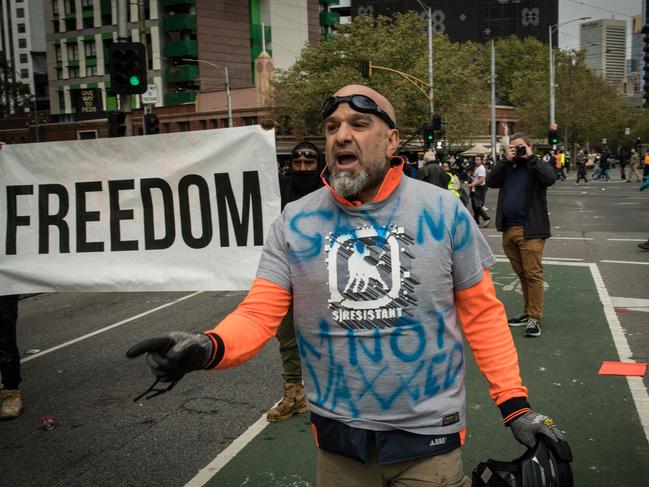 A man yells at police on Elizabeth Street near the CFMEU office on September 21, 2021 in Melbourne. Picture: Getty Images