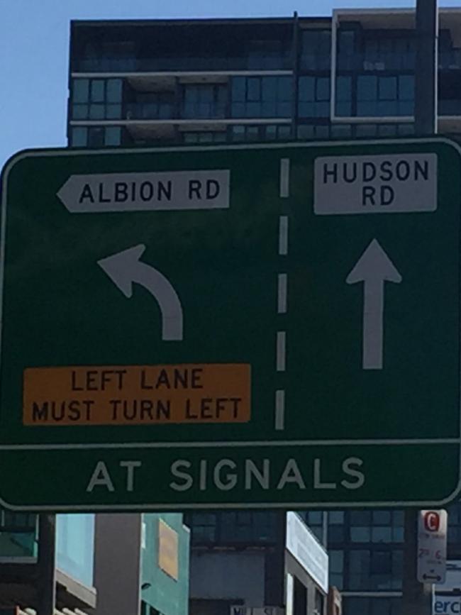 The traffic signs at the Albion Overpass, with The Hudson on Albion Hill behind it. PICTURE: GARY EVANS