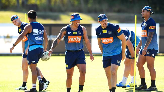 Erin Clark (centre) laughs during a Gold Coast Titans NRL training session at the Titans High Performance Centre on the Gold Coast, Tuesday, June 2, 2020. (AAP Image/Albert Perez)