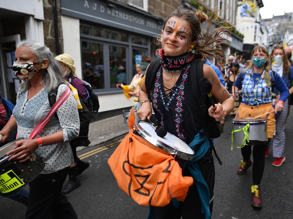 Activists take part in an Extinction Rebellion climate change protest march in St Ives, Cornwall.