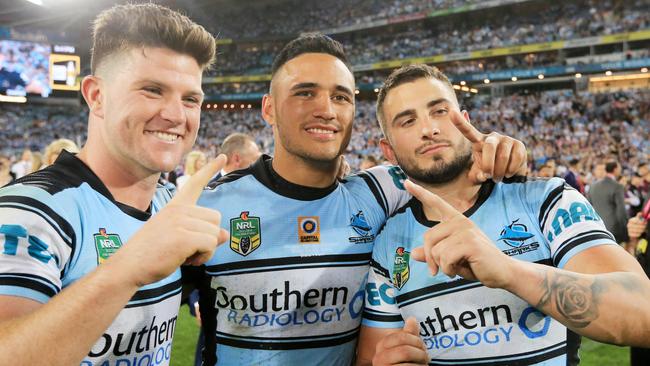 Chad Townsend, Valentine Holmes and Jack Bird celebrate Cronulla’s grand final win. Picture: Mark Evans