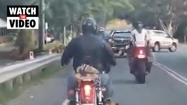 Motorcycle rider living dangerously on Captain Cook Highway