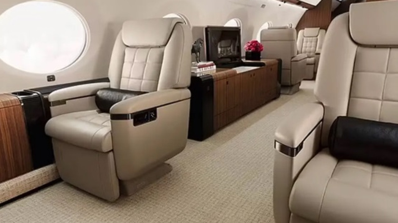 Inside, the jet accommodates 19 passengers and offers high-end amenities, including leather recliner seats, a dining area, a fully stocked bar and a private bedroom. Picture: Gulfstream