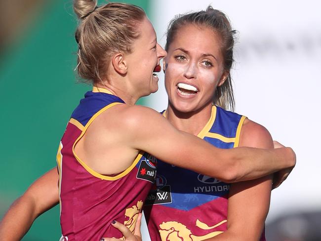 Kate McCarthy of the Lions celebrates her goal with Kaitlyn Ashmore during the AFLW womens match between the Brisbane Lions and Collingwood Magpies. Pic Darren England