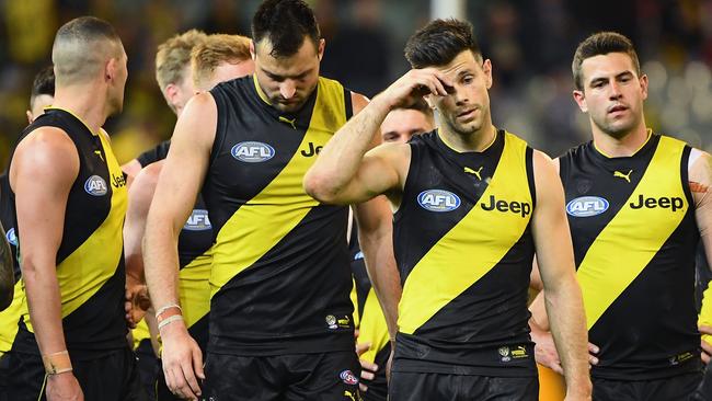 Trent Cotchin leads Richmond off after its shock preliminary final loss last Friday.