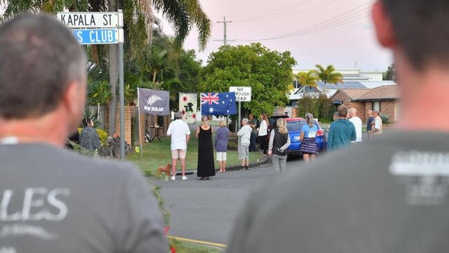 Mooloolaba residents light up the dawn for Anzac Day.