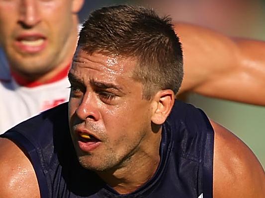 FREMANTLE, AUSTRALIA - MARCH 05: Stephen Hill of the Dockers gathers the ball during the NAB Challenge match between the Fremantle Dockers and the Melbourne Demons at Fremantle Oval on March 5, 2015 in Fremantle, Australia. (Photo by Paul Kane/Getty Images)