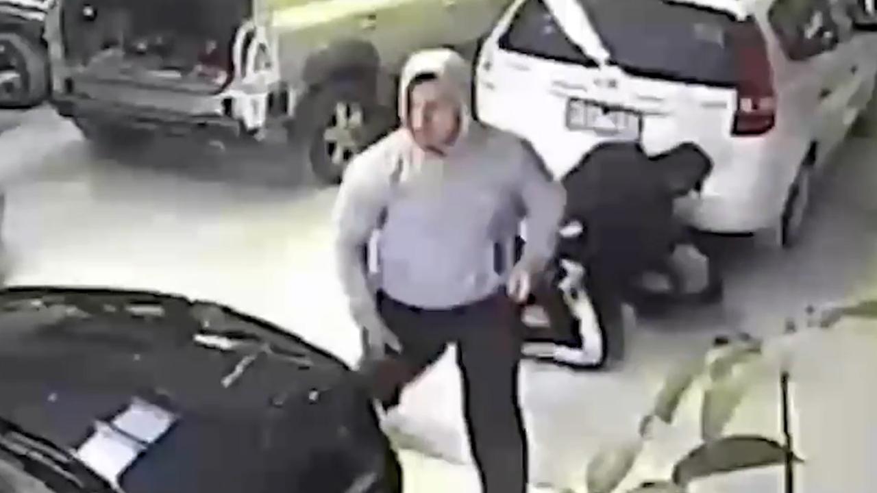 CCTV of Hawre Sherwani (in the white hoodie) bashing a man at a smash repair business in 2014.