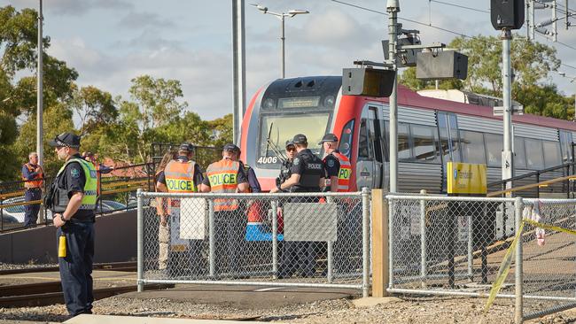 Police and emergency services at Tambelin train station in Evanston Gardens, after Rhyle was hit by the train in February. Picture: Matt Loxton