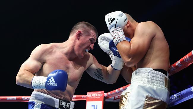 SYDNEY, AUSTRALIA - JUNE 16: Paul Gallen punches Justis Huni during their Australian heavyweight title fight at ICC Sydney on June 16, 2021 in Sydney, Australia. (Photo by Cameron Spencer/Getty Images)