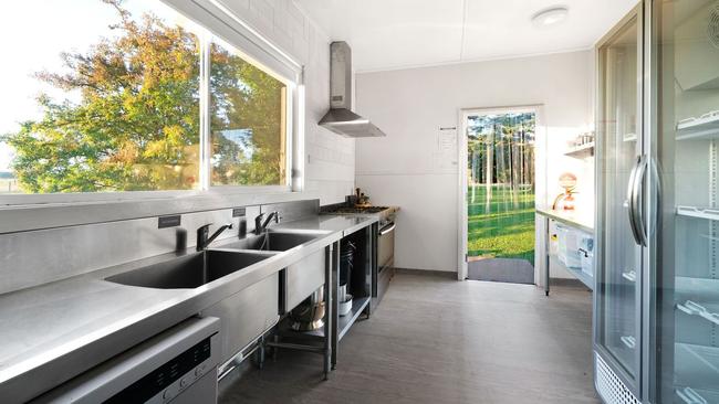 The stainless-steel kitchen is in the Sunday school building.