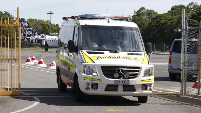 Border Force attend Cairns Airport as an  Ambulance collects a patient from Nauru who was being treated with a ventilator.  PICTURE: ANNA ROGERS