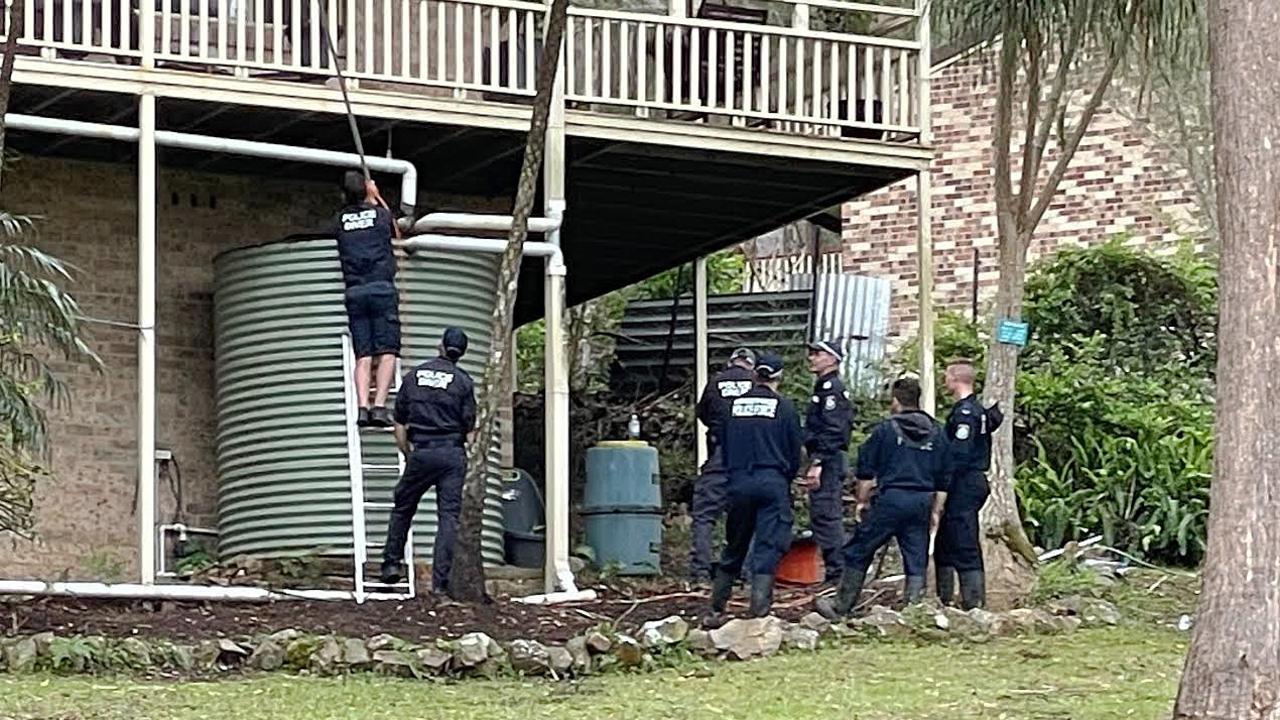 Police look at a water tank at the house where William Tyrrell vanished. Picture: NCA NewsWire/Peter Lorimer.