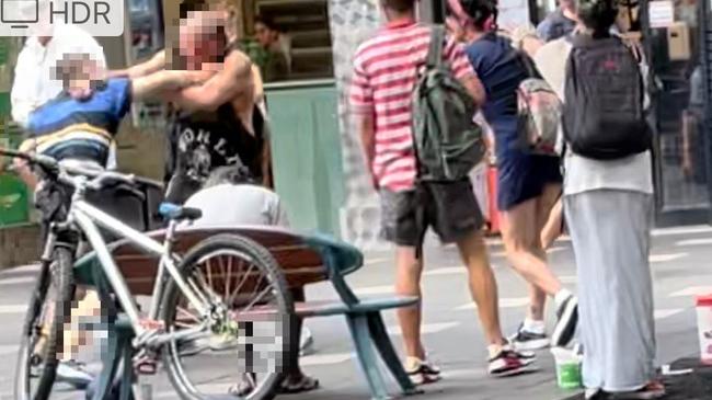 Punches are thrown during the brawl on a Surfers Paradise street.