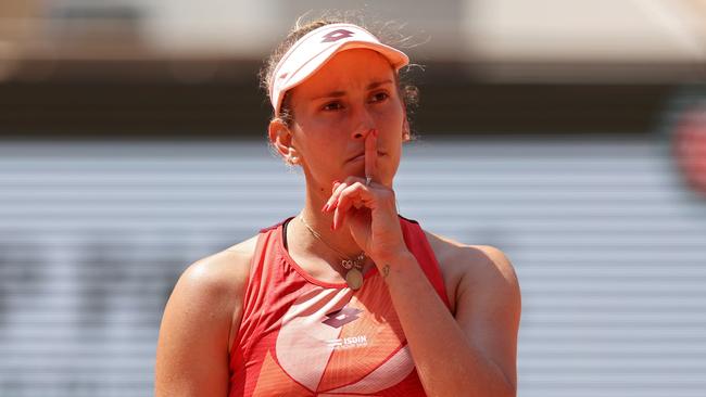 Elise Mertens of Belgium puts her finger to her lips as she celebrates a point against Jessica Pegula.