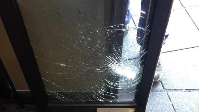 A Yagoona man, 35, allegedly spat on the perspex panel at Cabramatta police station before kicking and shattering the automatic glass sliding door.