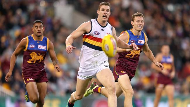 Crows Josh Jenkins chases the ball during the round 18 clash against the Brisbane Lions at the Gabba in Brisbane. Picture: Jono Searle/AAP