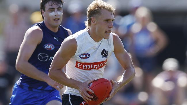 On the burst, Finlay Macrae of the Magpies kicks a running goal against North Melbourne. Picture: Michael Klein