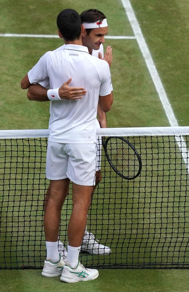 Hug it out. (Photo by WILL OLIVER / POOL / AFP)