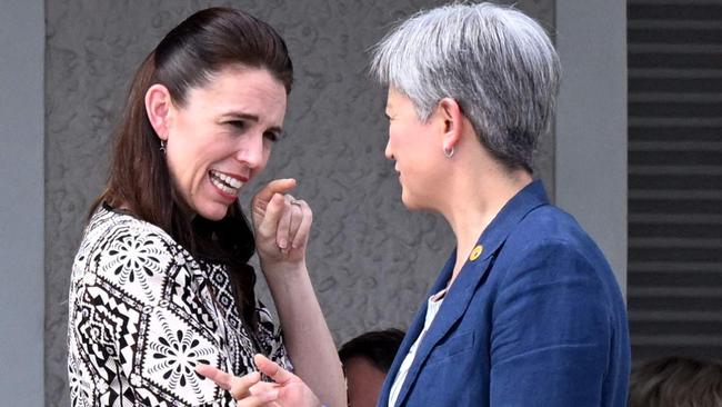 New Zealand Prime Minister Jacinda Ardern, left, chats with Penny Wong at the Pacific Islands Forum in Suva on Tuesday. Picture: AFP