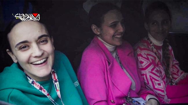 An image grab from a video released by the Hamas Media Office of Israeli hostages Emily Damari, Romi Gonen, and Doron Steinbracher in a Hamas vehicle before being handed over to the International Committee of the Red Cross in the Gaza Strip. Picture: AFP Photo/Handout/Hamas Media Office