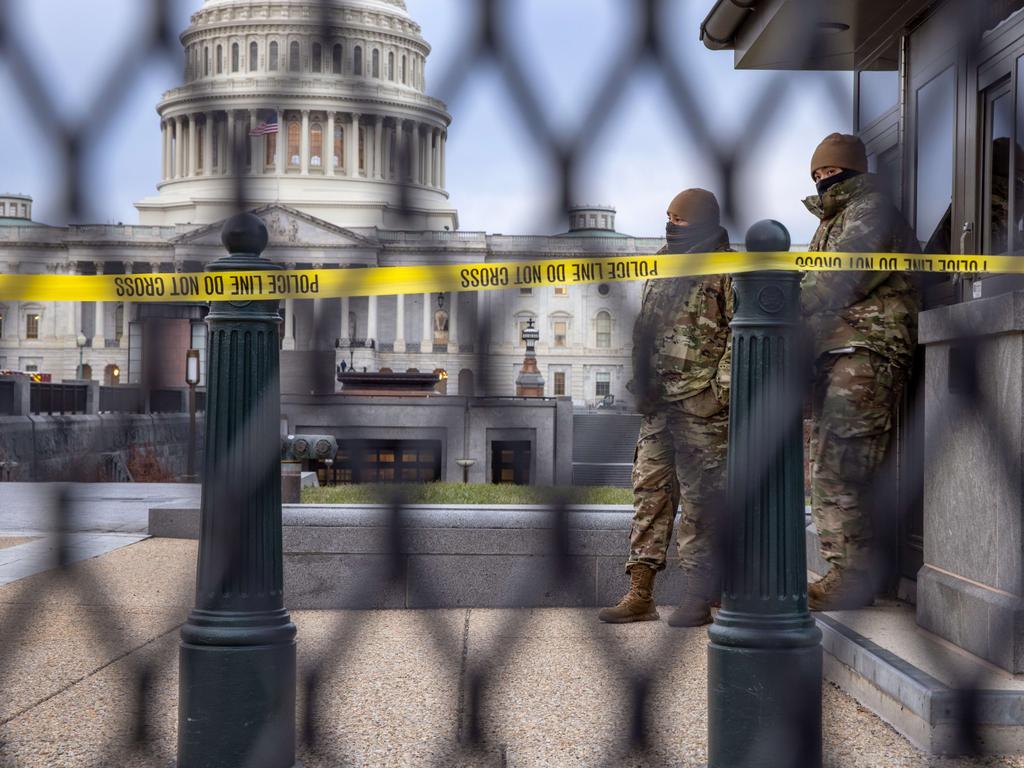 DC National Guard troops stand watch at the US Capitol on January 8, after fencing was put up following the storming of the Capitol. Picture: John Moore/Getty Images/AFP