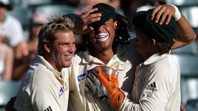 Australia's players Shane Warne, left, and Adam Gilchrist, right, congratulate Andrew Symonds. Picture: AP