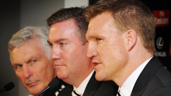 Mick Malthouse with Collingwood president Eddie McGuire and Nathan Buckley at the handover announcement. Pic. Craig Borrow