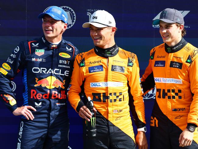 ZANDVOORT, NETHERLANDS - AUGUST 24: Second placed qualifier Max Verstappen of the Netherlands and Oracle Red Bull Racing, pole position qualifier Lando Norris of Great Britain and McLaren and third placed qualifier Oscar Piastri of Australia and McLaren react in parc ferme after qualifying ahead of the F1 Grand Prix of Netherlands at Circuit Zandvoort on August 24, 2024 in Zandvoort, Netherlands. (Photo by Mark Thompson/Getty Images)