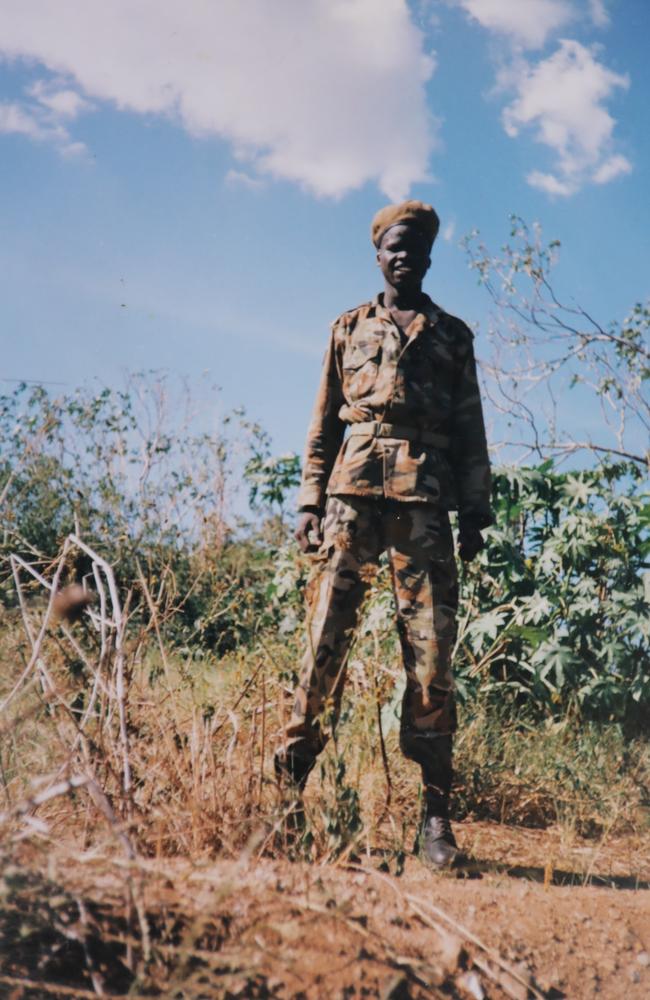 A teenage Ayik Chut as a Sudanese People's Liberation Army soldier.