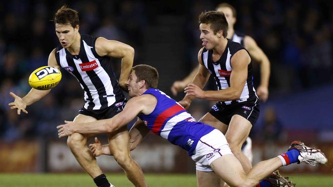 Kyle Martin grabs possession during his days at Collingwood.