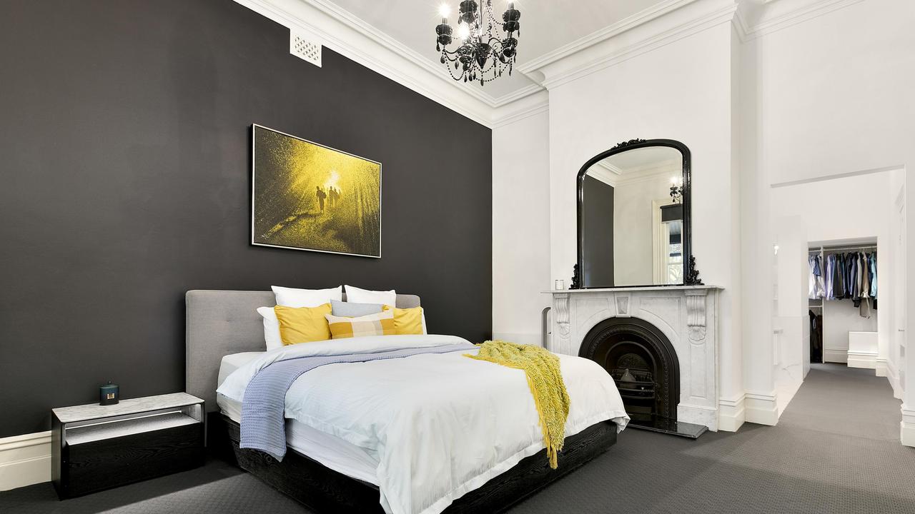 A fireplace and walk-in wardrobe in one of the bedrooms.