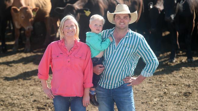 James and Fiona Paterson, and son Will, in the Hells Gate feedlot in the western Riverina. Picture Yuri Kouzmin