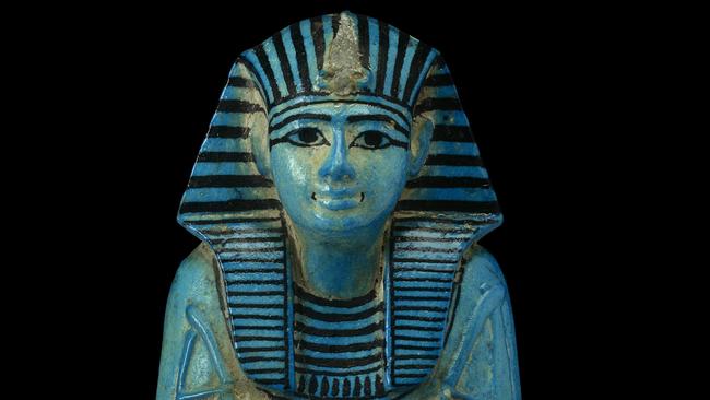 Only to be used in relation to NGV exhibition, Pharaoh (2024): Shabti of Pharaoh Sety I. From Tomb of Sety I, Valley of the Kings, Thebes, Egypt. 19th Dynasty, reign of Sety I, about 1294-1279 BC. Blue faience, H 22.8 cm, W 9.6 cm, D 9.6 cm © The Trustees of the British Museum