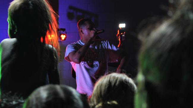 Fans watch Darwin-born rapper J-MILLA perform live in Wadeye on June 1, 2023 while the concert is streamed live on TikTok. Picture: Jason Walls