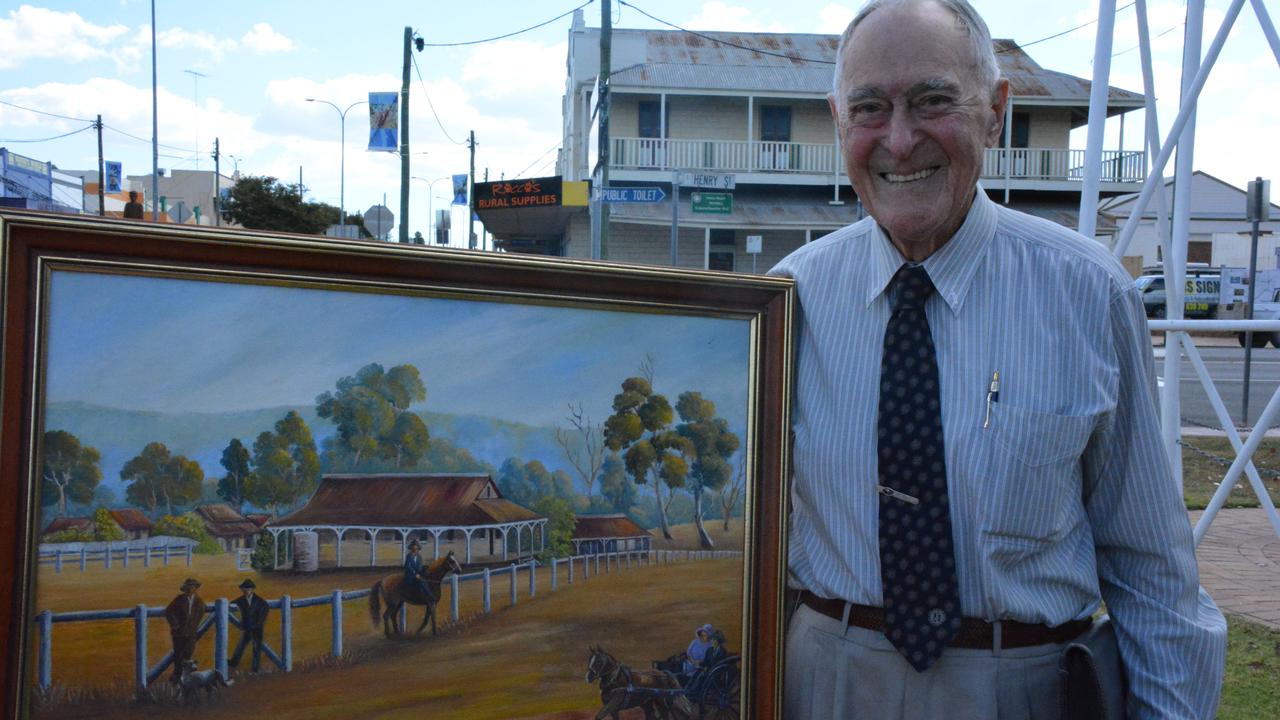 Former long standing Mayor Reg McCallum with a painting of the original court house. Photo Helen Spelitis / South Burnett Times