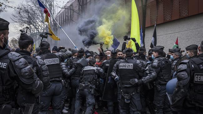 Protesters clash with French riot police during a protest over the proposed "global security law”. Picture: Siegfried Modola/Getty Images