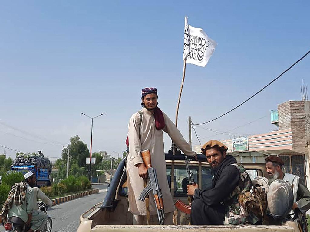 Taliban fighters drive an Afghan National Army vehicle through the streets of Laghman province on August 15. Picture: AFP