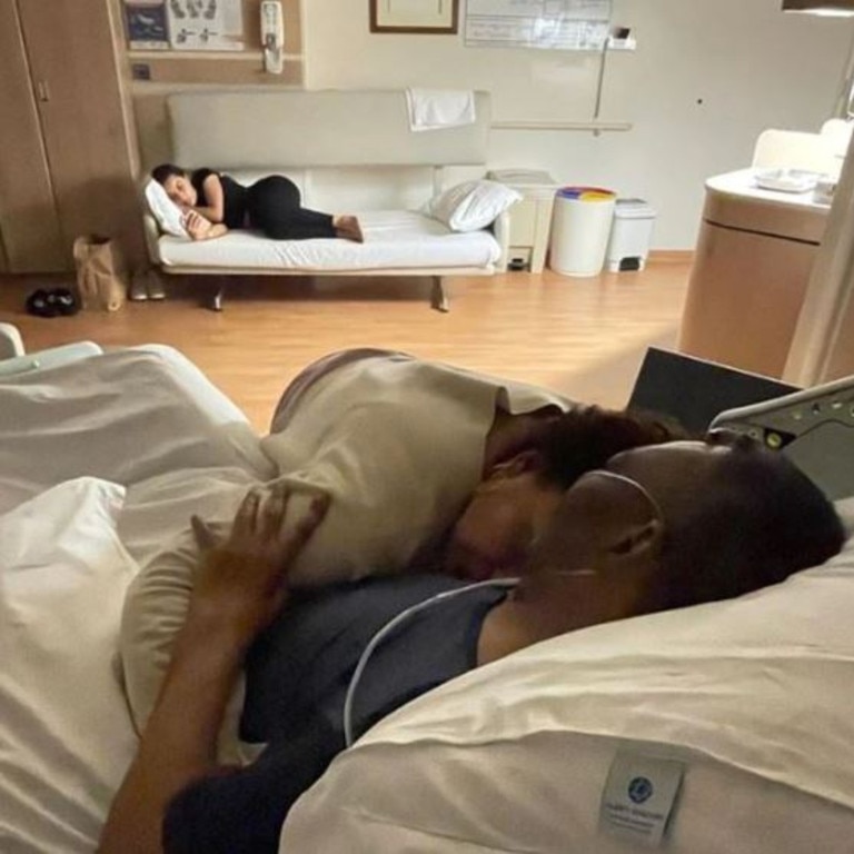 Kely cuddles her father in hospital. Picture: Instagram
