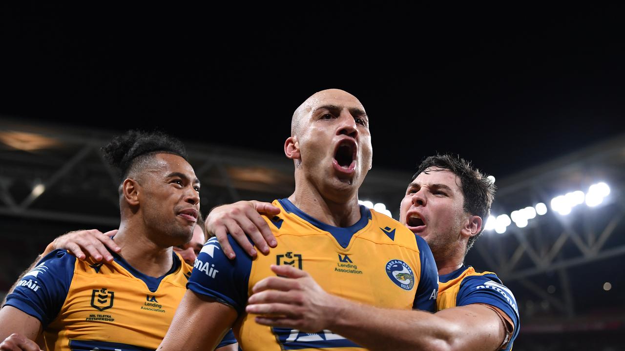 BRISBANE, AUSTRALIA - MARCH 12: Blake Ferguson of the Eels celebrates after scoring a try during the round one NRL match between the Brisbane Broncos and the Parramatta Eels at Suncorp Stadium, on March 12, 2021, in Brisbane, Australia. (Photo by Bradley Kanaris/Getty Images)