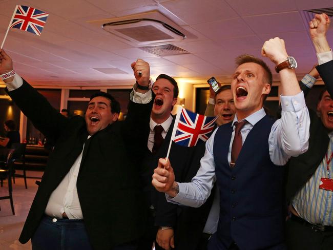 Leave EU supporters wave Union flags and cheer as the results come in. Picture: Geoff Caddick