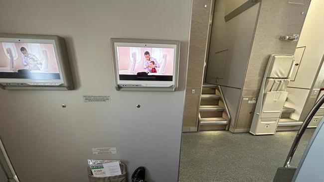 Room aplenty: A view of my seat’s bulkhead entertainment unit and stairs to the closest toilets.