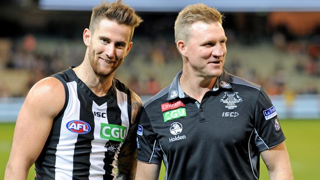 Jeremy Howe celebrates Collingwood’s win with coach Nathan Buckley.