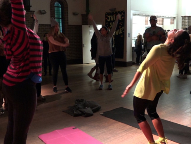 Attendees warm up with a bit of yoga and a stretch.