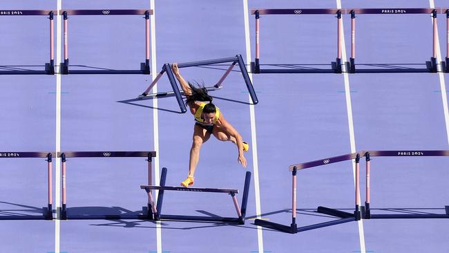 Michelle Jenneke of Team Australia knocks over a hurdle. (Photo by Patrick Smith/Getty Images)