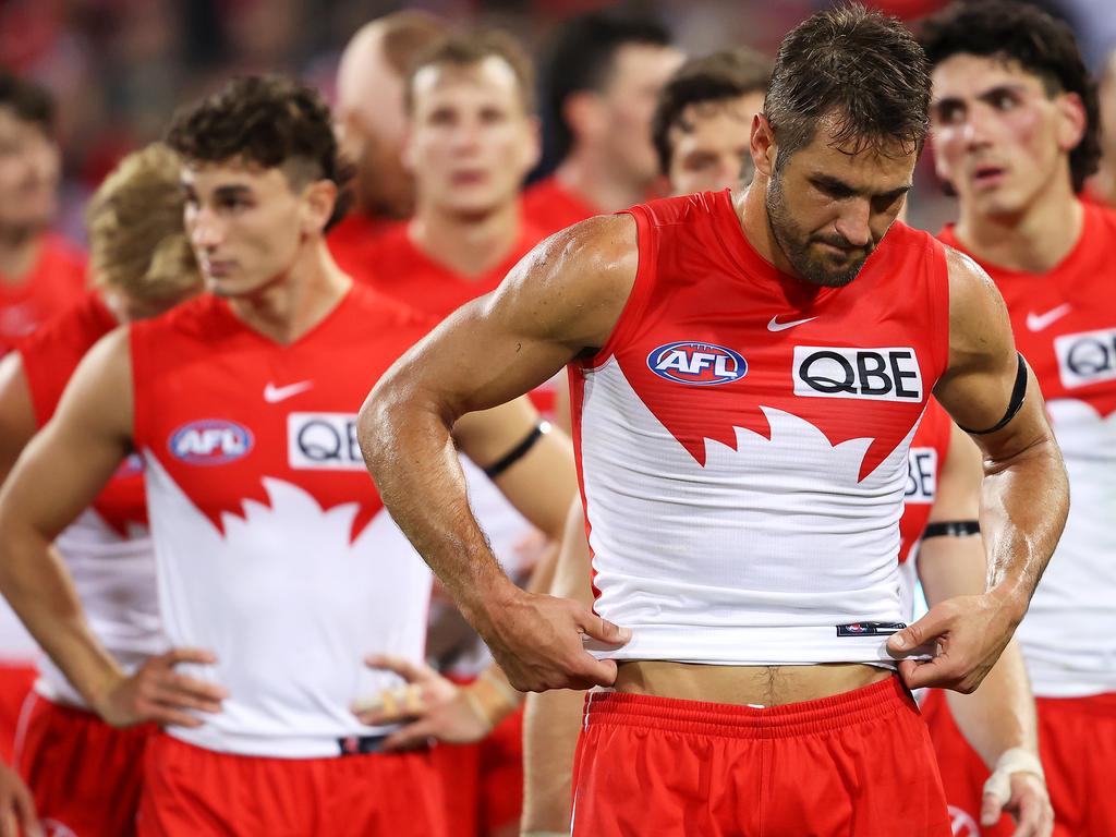 Josh P. Kennedy of the Swans and his team look dejected.