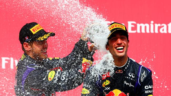 Daniel Ricciardo and Sebastian Vettel on the podium while Red Bull teammates in 2014. Picture: Mark Thompson/Getty Images)