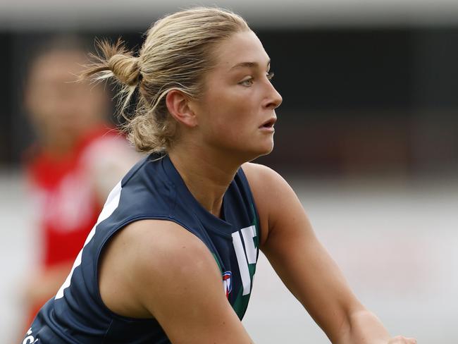 MELBOURNE, AUSTRALIA - APRIL 06:  Ash Centra of the AFL National Academy Girls handballs during the Marsh AFL National Academy Girls vs U23 All-Stars at Ikon Park on April 06, 2024 in Melbourne, Australia. (Photo by Darrian Traynor/AFL Photos/via Getty Images)