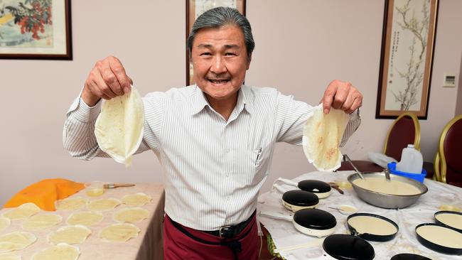 Simon prepares pancakes for his Peking Duck. Picture: Andy Brownbill